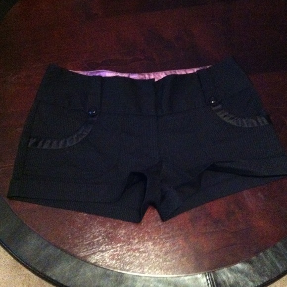 Black pinned strips shorts