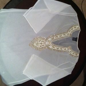 White and gold bathing suit cover up.