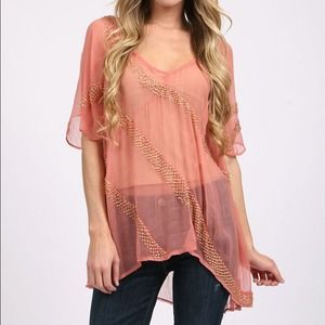 Free People peach pink oversized top.