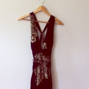 Gorgeous black dress with gold detailing.