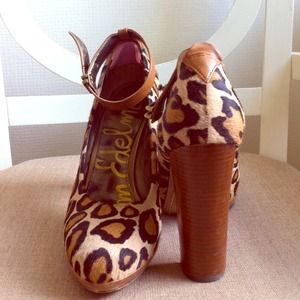 Leopard print pumps with ankle strap.