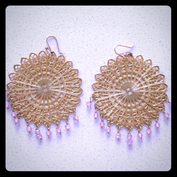 Gold plated pierced earrings with pink stones.