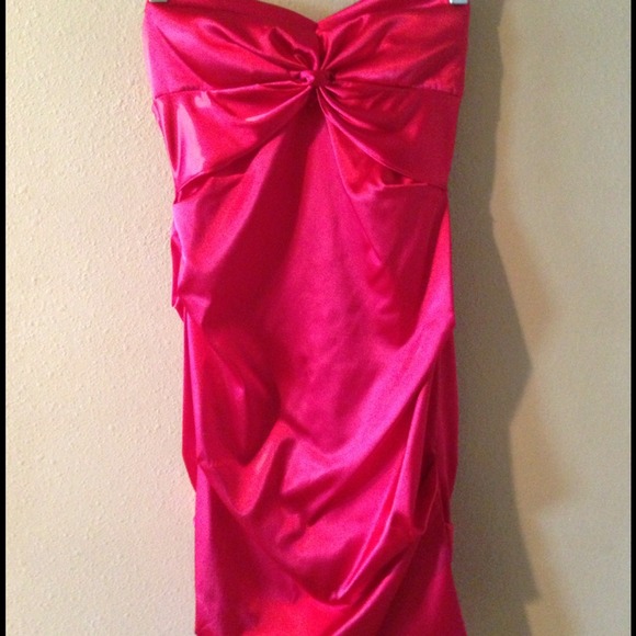 Red strapless, above the knee, dress.