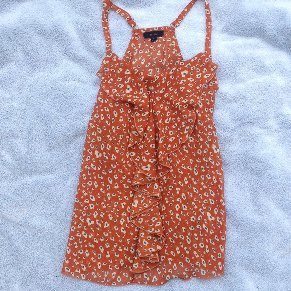 Orange tank top with ruffle.