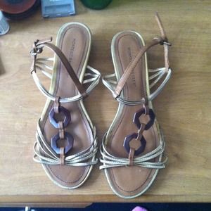 Gold sandals with wooden heel