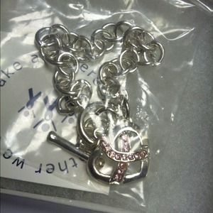 Silver breast cancer bracelet w/pink crystal heart