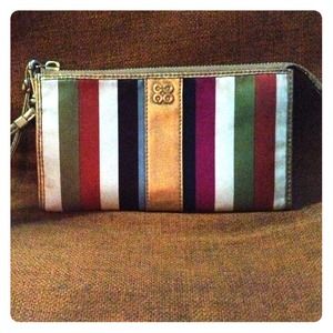 Authentic Coach clutch. Small stain.