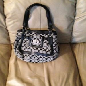 Black leather trim COACH. purse