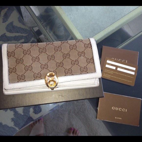Gucci wallet 100% authentic. Noticeable wear.