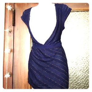 Blue top with gold lines stitched throughout