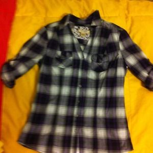 Plaid shirt. Quarter length sleeves.