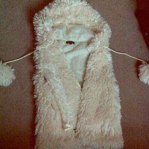 White fuzzy vest.