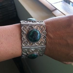 Silver bracelet  with green stone.