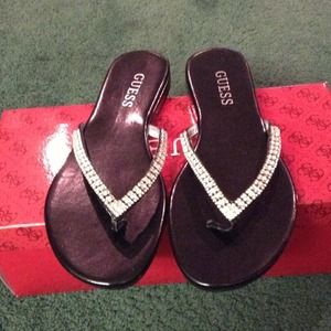 HoLD. HolD Guess Jasper flip flops in size 6.