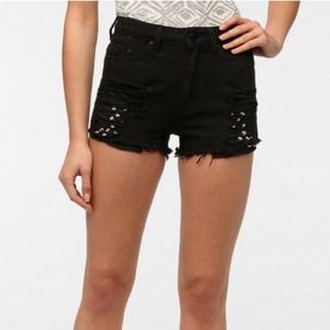 Cheeky black high waisted shorts with studs