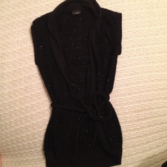 Black Sparkly sleeveless top. Ties closed.
