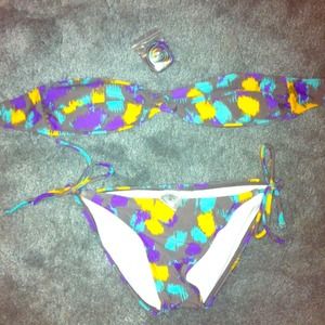 Kirra Gray, Yellow, Blue, & Purple Swim Suit