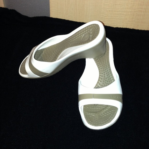 Crocs open toes, slip on sandal.