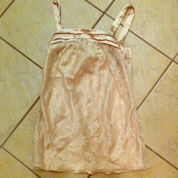 A beautiful Charlotte Russe top in a creme color.