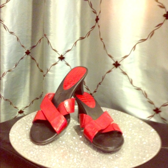 Red PREDICTIONS sandal with a heel.