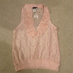 Pink lace tank top with ruffle detail.
