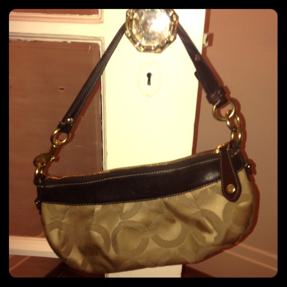 Gold and Dark Brown Coach purse with pink interior