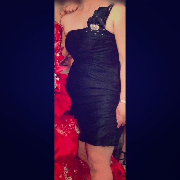 Black one shoulder, bejeweled dress.