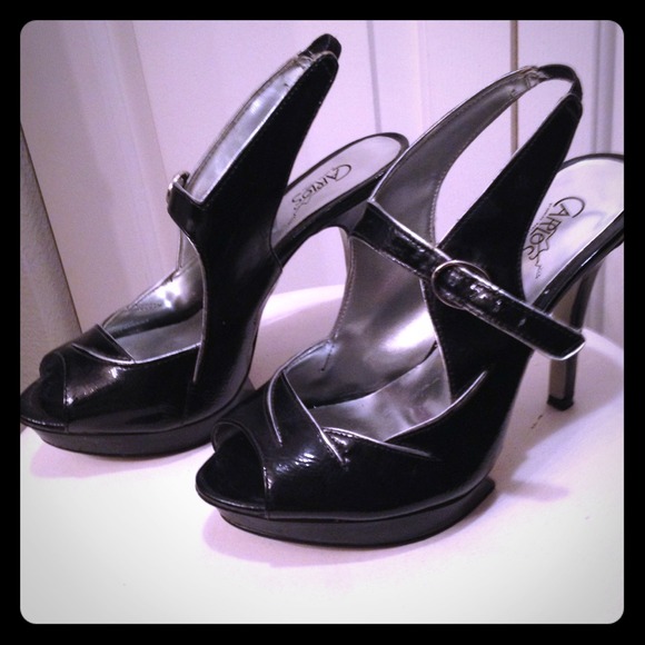 Black platform Carlos by Carlos Santana heels.