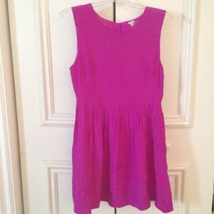 Magenta colored a line dress.