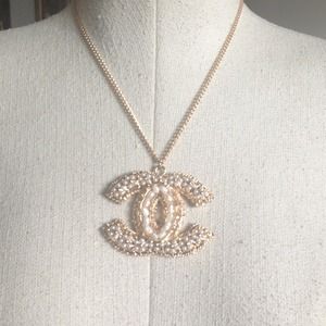 CHANEL logo necklace. Gold plated and jeweled