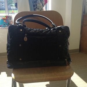 Nest black quilted diaper bag.