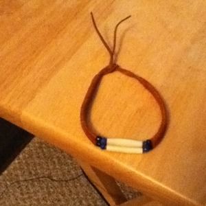 White, blue, and black bead bracelet.