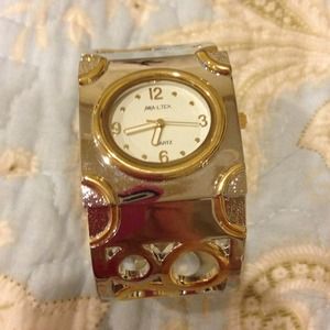 Cuff watch. Gold and silver in color