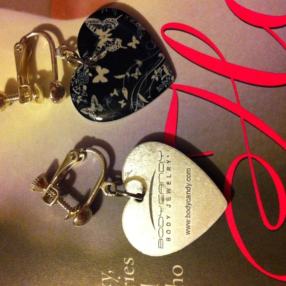 Black heart, white butterfly ear rings.