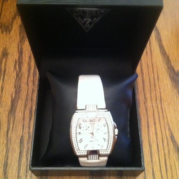 Guess watch with white band.