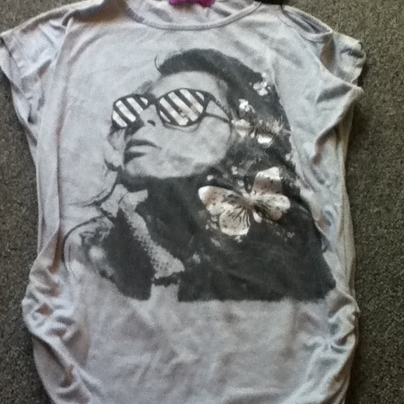 Grey t shirt with women on it.