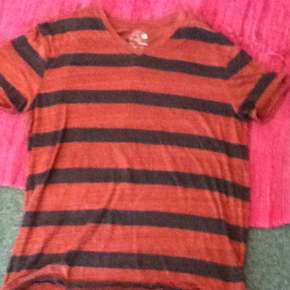 Men's v neck red and black stripped shirt.
