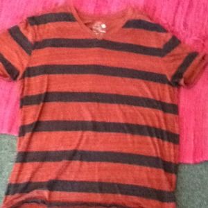 Men's v neck red and black stripped shirt.