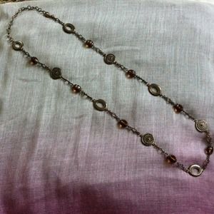 Brown glass bead and silver medallion necklace