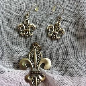 Silver freur di lis french hook earrings.