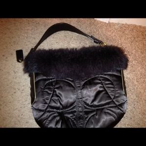 ON HOLD!!!! Coach purse with rabbit fur lining<3