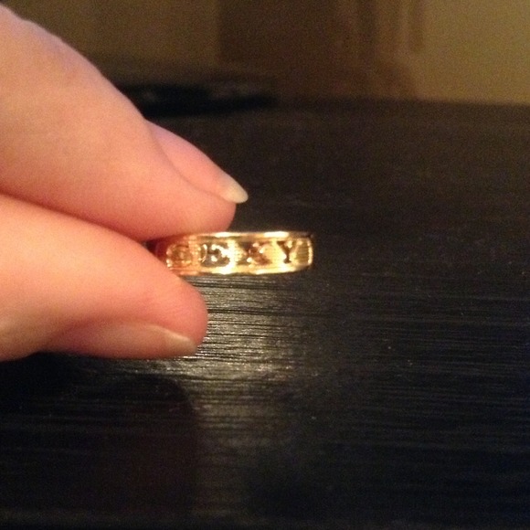 Gold Toe Ring with the word SEXY on it