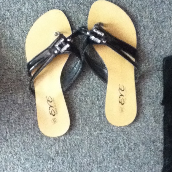 Brown and black flip flops.