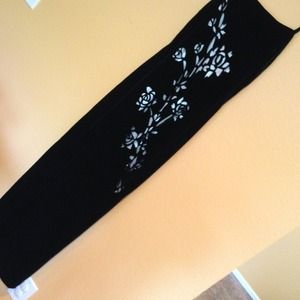 Formal black dress with silver rose cut-out