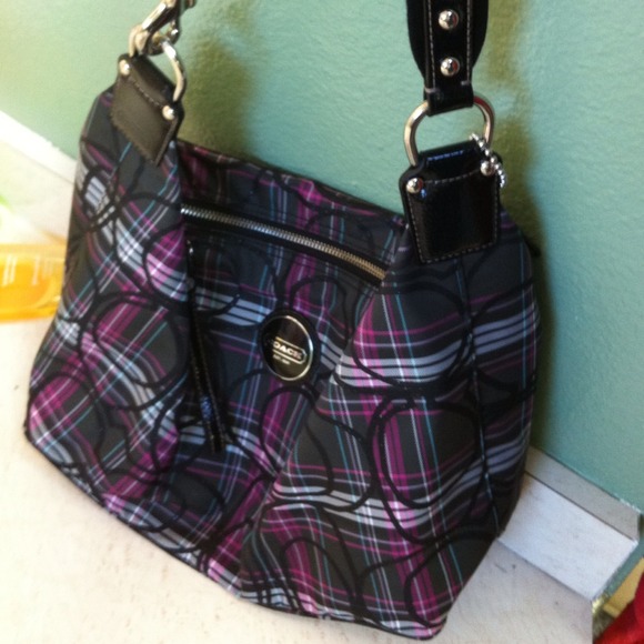 Black and striped Coach bag