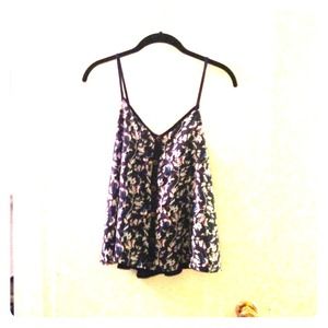 Navy blue camisole with floral/bird pattern.
