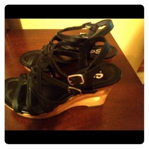 Black strappy sandal with 2.5 " wedge heel