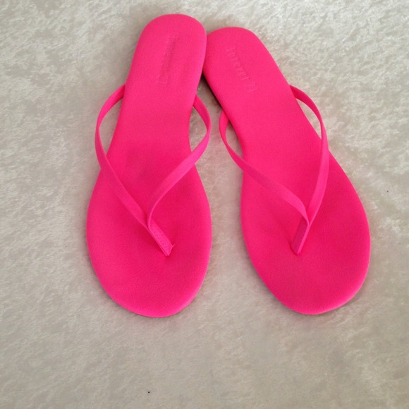 Hot pink flip flops