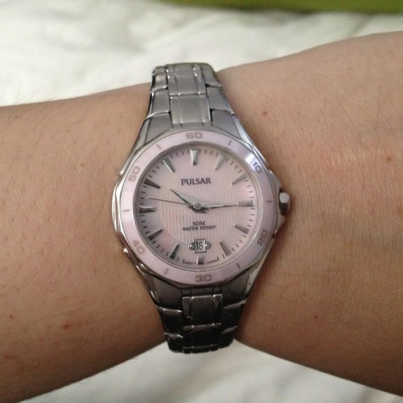 Pulsar watch with pink ceramic dial.