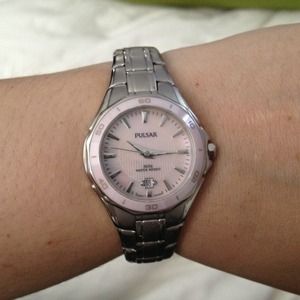 Pulsar watch with pink ceramic dial.